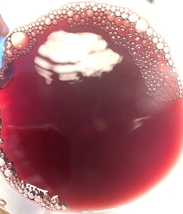 A glass of Beaujolais ruby red wine color