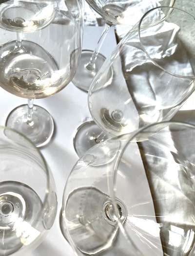 Empty wine glasses on a table with a white tablecloth