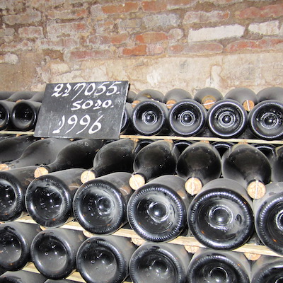 Champagne bottles are kept in cool cellars where the secondary fermentation process happens