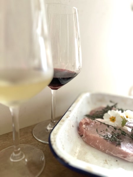 For red wines that go with pork try Pinot Noir, for white whites try Chardonnay or Riesling